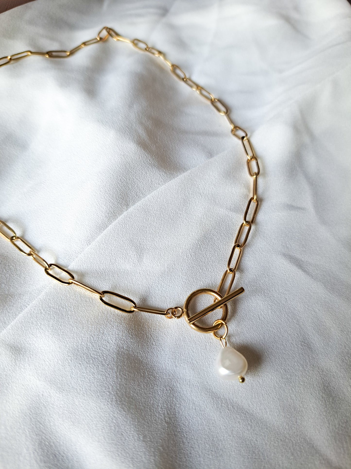 18k gold paperclip necklace with a pearl charm