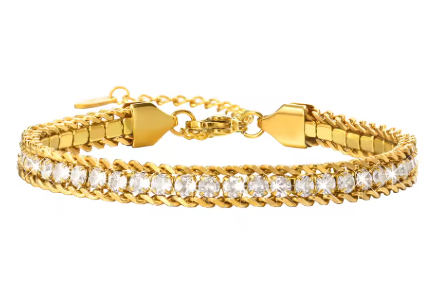 Gold bracelet with clear stones on a white background