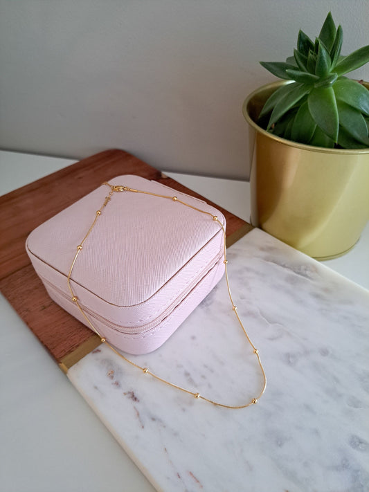 Beaded gold chain necklace with delicate detailing