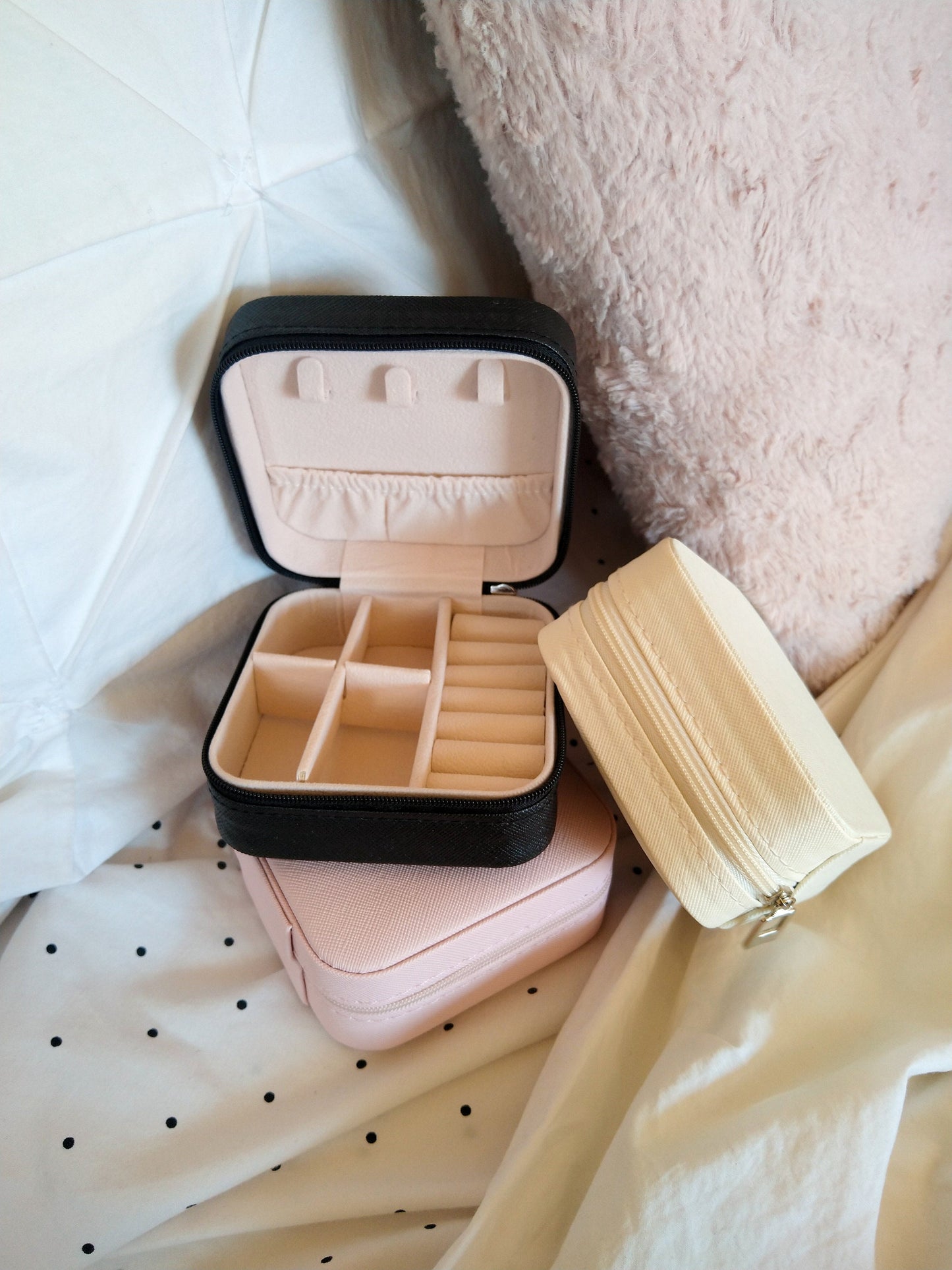 three jewellery cases stacked on each other