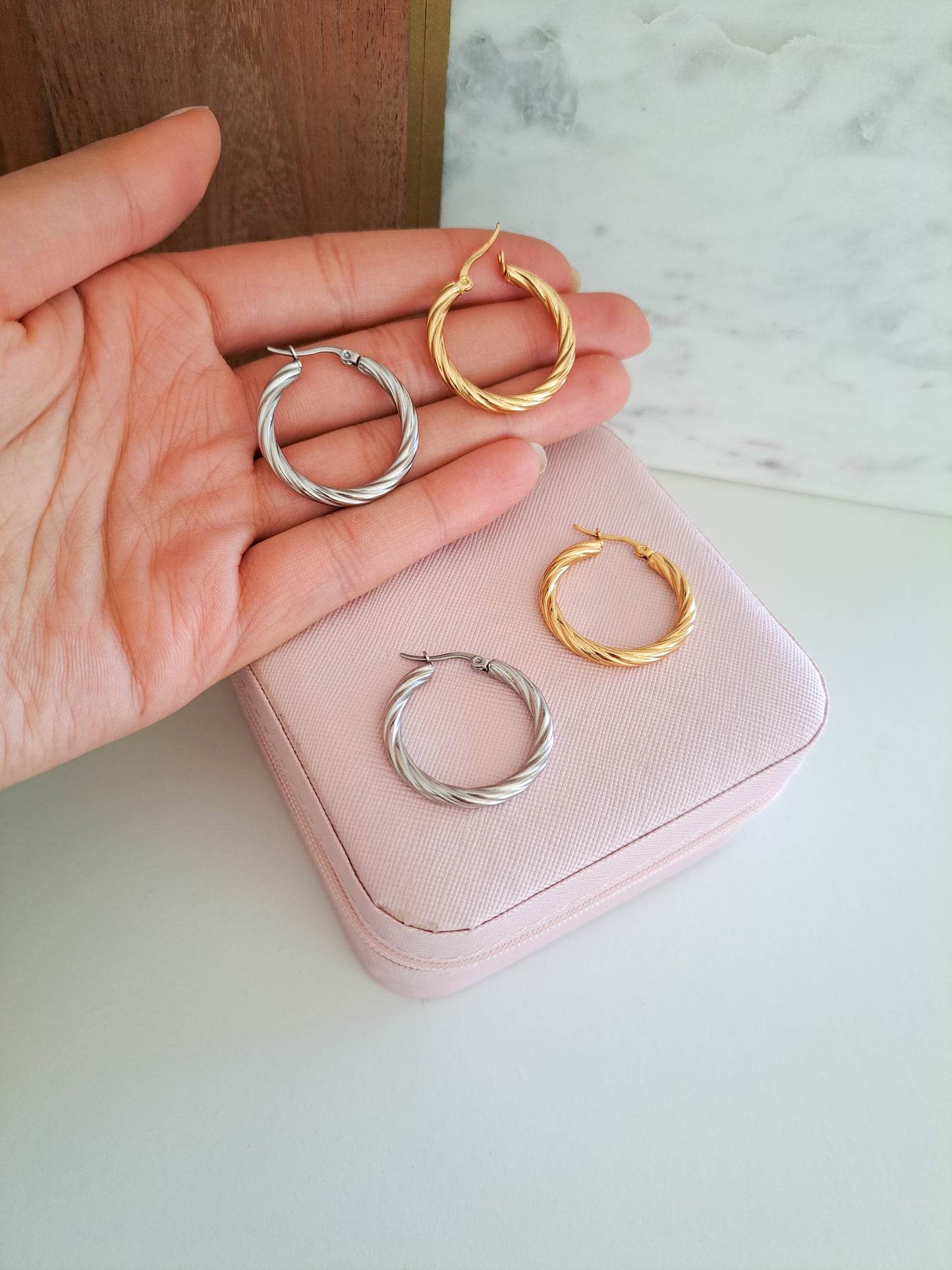 gold and silver hoops on a jewellery box 