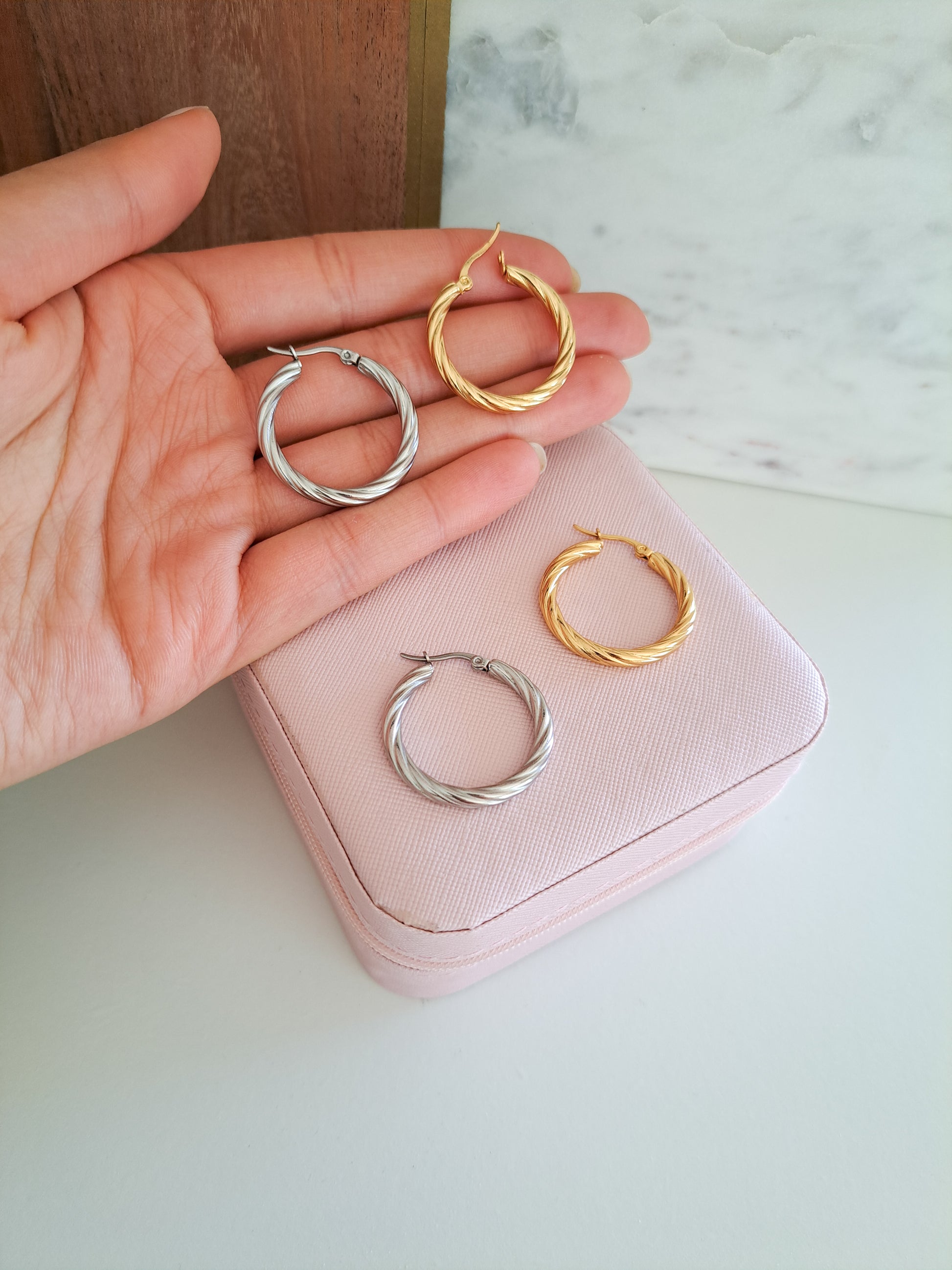 gold and silver hoops on a jewellery box 