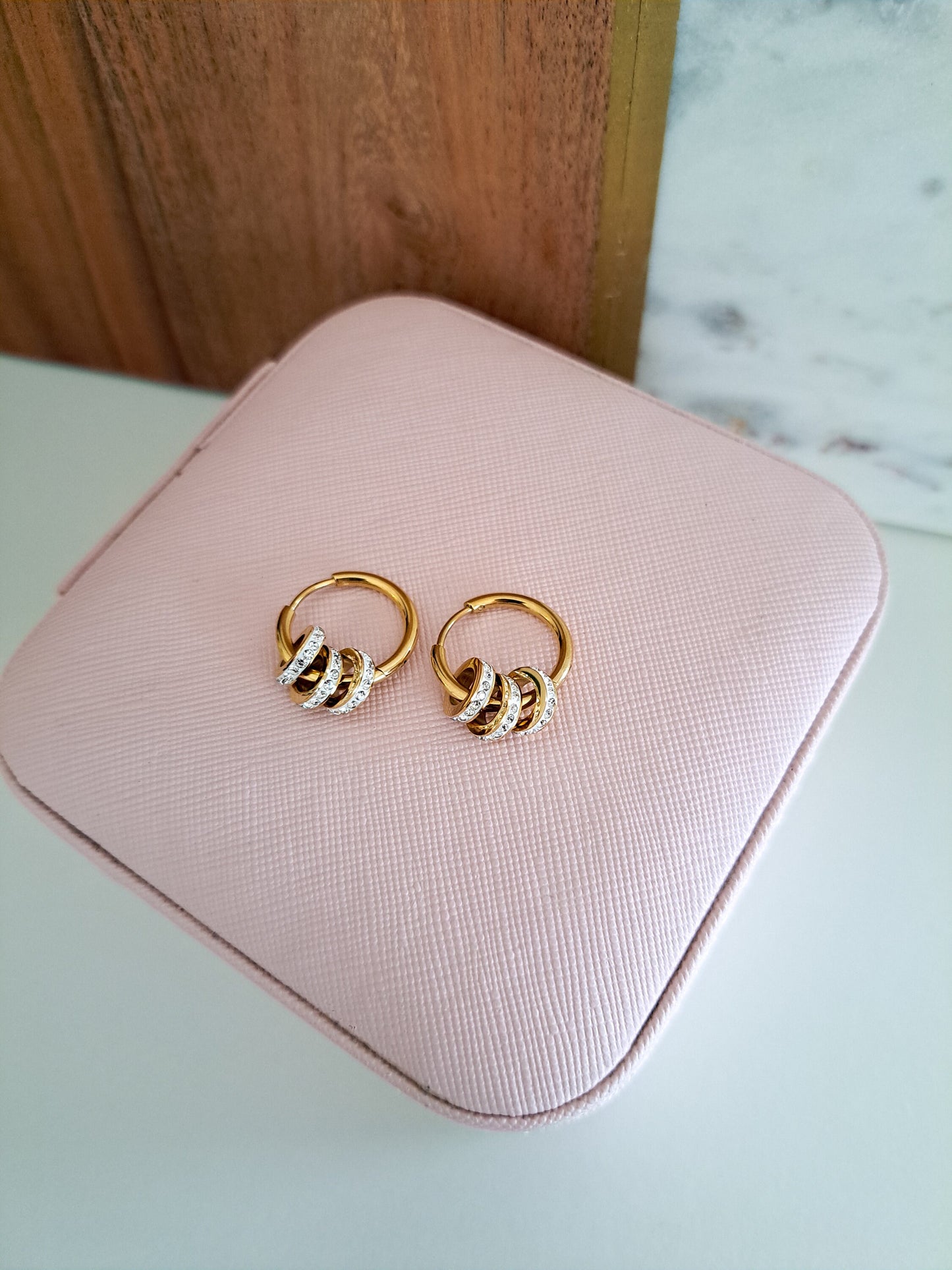 gold hoop earrings with diamond rings in them 